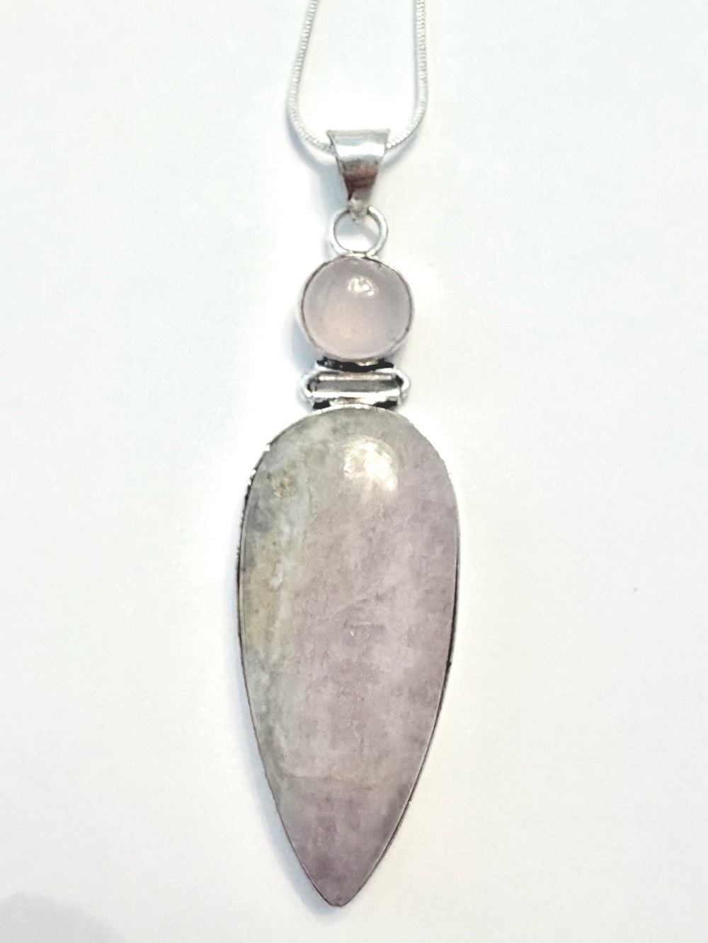 2 1/2 inch, hinged, pink Kunzite and Rose Quartz pendant on a silver chain.